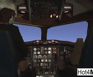 Flight attendant with big fake tits takes cock in the